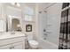 Bright bathroom with a sink, toilet, and bathtub/shower combination behind a patterned shower curtain at 4019 Channel Islands Way, Lancaster, SC 29720