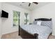 Bedroom with a plaid comforter on the bed, light-colored walls, and two windows bringing in natural light at 4019 Channel Islands Way, Lancaster, SC 29720