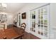 Dining area showcasing french doors leading into another seating area and hardwood flooring at 4019 Channel Islands Way, Lancaster, SC 29720