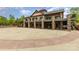 A multi-level structure showcases stone pillars and multiple balconies, offering grand architectural appeal at 4019 Channel Islands Way, Lancaster, SC 29720