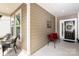Inviting covered front porch with seating, a wreath on the front door, and neutral siding at 4019 Channel Islands Way, Lancaster, SC 29720