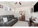 Relaxing living area with leather sofa, television, and french doors leading to the dining area at 4019 Channel Islands Way, Lancaster, SC 29720
