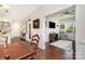 View from the dining area to a seating area featuring hardwood flooring and neutral walls at 4019 Channel Islands Way, Lancaster, SC 29720