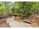 A tranquil park bench sits along a winding path, inviting peaceful moments amidst nature at 4019 Channel Islands Way, Lancaster, SC 29720
