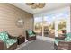 Covered patio featuring comfortable seating, a ceiling fan, and sliding doors opening to a backyard with patio furniture at 4019 Channel Islands Way, Lancaster, SC 29720