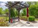Shaded rest area with pergola, park bench and umbrella is a quiet place to relax outdoors at 4019 Channel Islands Way, Lancaster, SC 29720