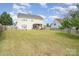 Expansive backyard featuring lush lawn, privacy fence, and covered patio for outdoor gatherings at 407 Goodloe Dr, Charlotte, NC 28262