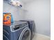 Laundry room featuring front loading washer and dryer and a wire shelf at 407 Goodloe Dr, Charlotte, NC 28262
