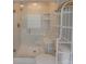 Bright bathroom featuring glass enclosed shower and decorative shelving for added storage and style at 5412 Crosshill Ct, Charlotte, NC 28277