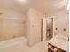 Bright bathroom with a tub and shower combination, and a vanity at 5412 Crosshill Ct, Charlotte, NC 28277