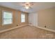 Bedroom featuring carpet, two windows, and white trim at 5412 Crosshill Ct, Charlotte, NC 28277