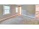 Neutral bedroom with two windows and carpeting at 5412 Crosshill Ct, Charlotte, NC 28277