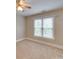 Bedroom featuring neutral carpeting, window with blinds, and ceiling fan at 5412 Crosshill Ct, Charlotte, NC 28277