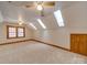 Large bonus room featuring skylights, carpeting and ample natural light at 5412 Crosshill Ct, Charlotte, NC 28277
