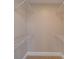 Spacious walk-in closet with installed shelving and carpet flooring at 5412 Crosshill Ct, Charlotte, NC 28277