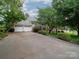 Charming home featuring a spacious driveway and a well-manicured front lawn at 5412 Crosshill Ct, Charlotte, NC 28277