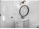 Updated bathroom boasts a marble vanity, black accents, and a decorative mirror at 5520 Chestnut Dr, Hickory, NC 28602