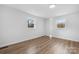 Bedroom with hardwood floors and dual windows providing ample natural light at 5520 Chestnut Dr, Hickory, NC 28602