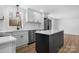 Open concept kitchen with a center island, stainless steel appliances, and ample cabinet space at 5520 Chestnut Dr, Hickory, NC 28602