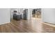 Open-concept kitchen view with wood-look floors and stainless-steel appliances at 5520 Chestnut Dr, Hickory, NC 28602