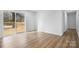 Bright living room with sliding glass door leading to outdoor deck and beautiful hardwood floors at 5520 Chestnut Dr, Hickory, NC 28602