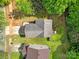 Aerial top-down view of home with gray roof, green yard, and concrete driveway at 5524 Wyalong Dr, Charlotte, NC 28227