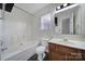 Cozy bathroom featuring a tub and shower combination, classic vanity, and neutral fixtures at 5524 Wyalong Dr, Charlotte, NC 28227