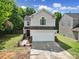Charming two-story home with a two-car garage and well-manicured front yard at 5524 Wyalong Dr, Charlotte, NC 28227