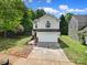 Charming two-story home with a two-car garage, landscaping, and a concrete driveway at 5524 Wyalong Dr, Charlotte, NC 28227