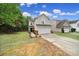 Charming home with a two-car garage, lush lawn, brick accents, and inviting curb appeal at 5524 Wyalong Dr, Charlotte, NC 28227