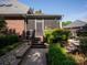 Exterior shot showing a screened-in porch and stone path at 5809 Woodleigh Oaks Dr, Charlotte, NC 28226