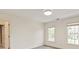 Bright bedroom with neutral colors, trim work and windows at 5809 Woodleigh Oaks Dr, Charlotte, NC 28226