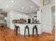 Open concept kitchen with breakfast bar and stainless steel appliances at 5809 Woodleigh Oaks Dr, Charlotte, NC 28226