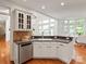 Kitchen featuring stainless steel appliances, stone countertops and eat-in breakfast nook at 5809 Woodleigh Oaks Dr, Charlotte, NC 28226