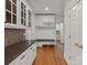 Hallway featuring built-in bench and coat hooks at 5809 Woodleigh Oaks Dr, Charlotte, NC 28226