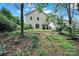 Spacious backyard with lush greenery, a patio, and tiered landscaping at 656 Hosta Dr, Fort Mill, SC 29715