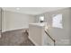 Hallway with staircase and natural light, providing an airy transition space at 656 Hosta Dr, Fort Mill, SC 29715