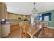 Eat-in kitchen features a center island, stainless steel appliances, and wood cabinetry at 656 Hosta Dr, Fort Mill, SC 29715