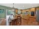 The kitchen has stainless steel appliances, ample cabinet space, and a dining table at 656 Hosta Dr, Fort Mill, SC 29715