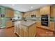 Modern kitchen with an island, stainless steel appliances, and plenty of cabinet space at 656 Hosta Dr, Fort Mill, SC 29715