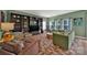 Cozy living room with comfortable furniture, built-in shelving, and natural light at 656 Hosta Dr, Fort Mill, SC 29715