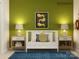Stylish Bedroom featuring modern crib, coordinating side tables, lamps, and a playful lion themed art print at 671 Mile Creek Rd, Edgemoor, SC 29712