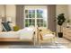 Bedroom showcasing a large window, neutral color palette, and comfortable furnishings at 671 Mile Creek Rd, Edgemoor, SC 29712