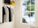 Bright walk-in closet featuring built-in shelving and plenty of natural light from the window at 671 Mile Creek Rd, Edgemoor, SC 29712