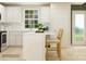 Bright kitchen featuring white cabinets, an island, and modern appliances at 671 Mile Creek Rd, Edgemoor, SC 29712