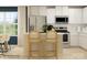 Contemporary kitchen featuring white cabinets, stainless steel appliances, and an island with seating at 671 Mile Creek Rd, Edgemoor, SC 29712
