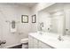 Bright bathroom featuring dual sinks, white cabinets, granite countertops, a large mirror, and shower at 1813 Millstream Dr, China Grove, NC 28023