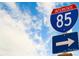 Interstate 85 sign under a blue and cloudy sky with a secondary sign with an arrow at 1813 Millstream Dr, China Grove, NC 28023