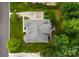Stunning aerial view of the home showcasing its well-manicured lawn, mature trees, and inviting outdoor deck at 7005 Camrose Crossing Ln, Matthews, NC 28104