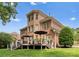 Brick home with a spacious deck, perfect for outdoor entertaining at 7005 Camrose Crossing Ln, Matthews, NC 28104